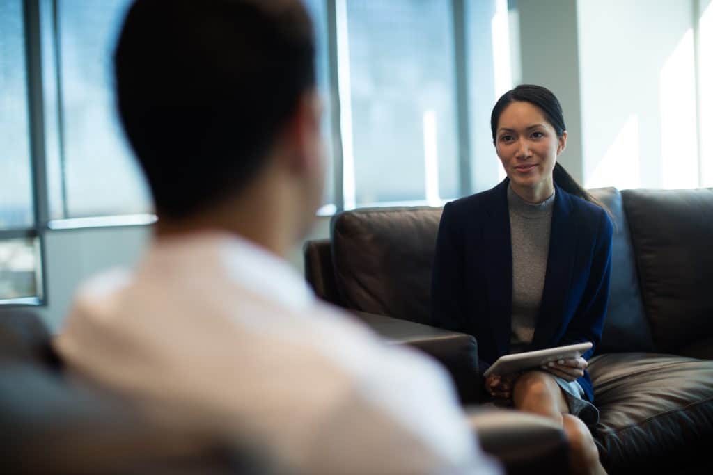 businesswoman discussing with male colleague while 2025 04 03 13 27 05 utc 2