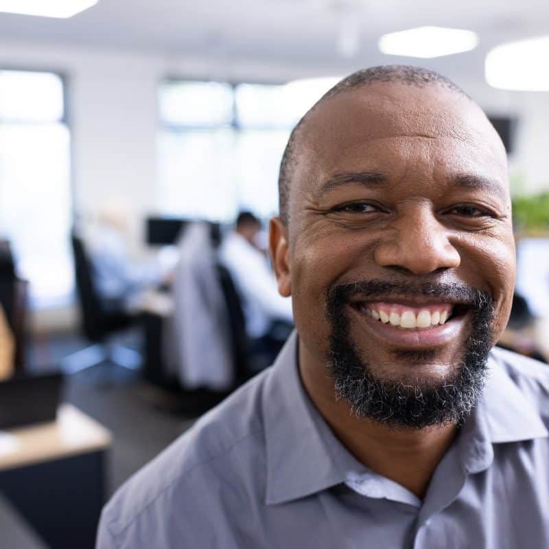 happy african american businessman looking at came 2025 04 04 01 58 42 utc 1