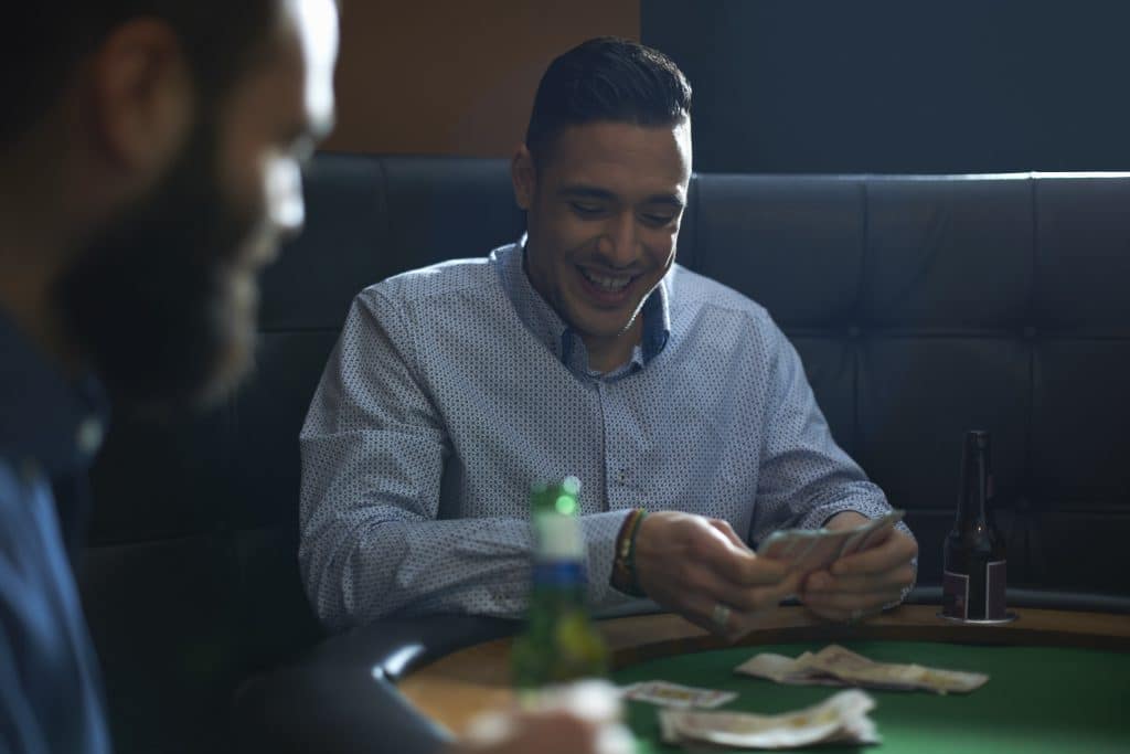 male friends playing card game for cash at pub car 2025 04 03 06 15 29 utc