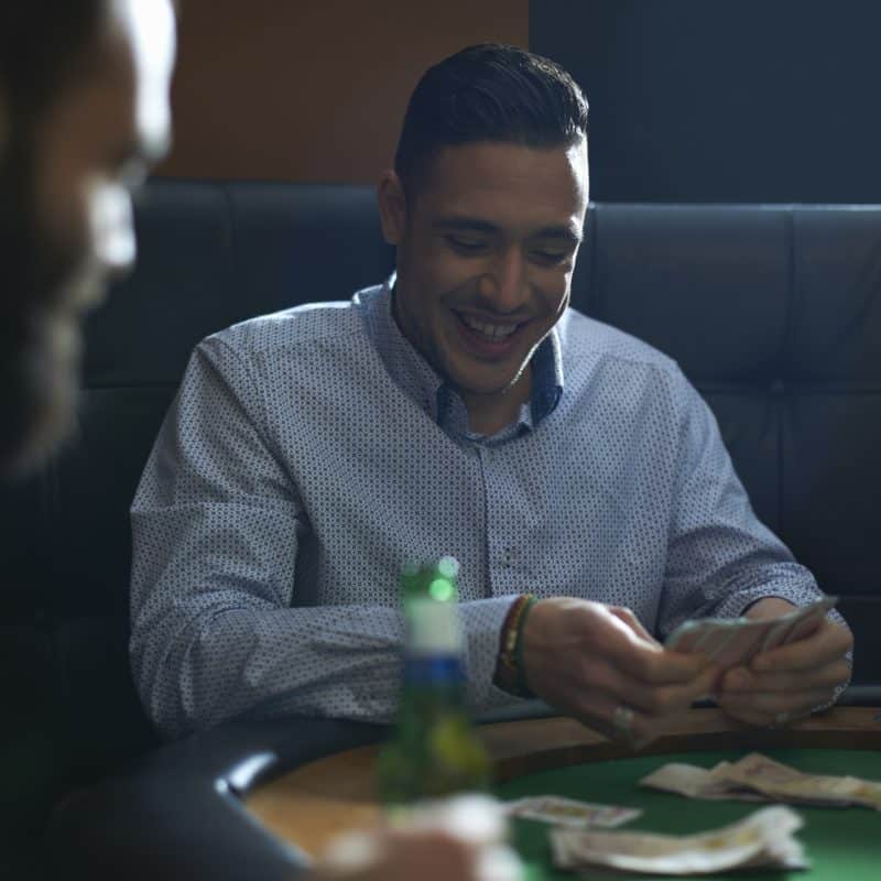 male friends playing card game for cash at pub car 2025 04 03 06 15 29 utc