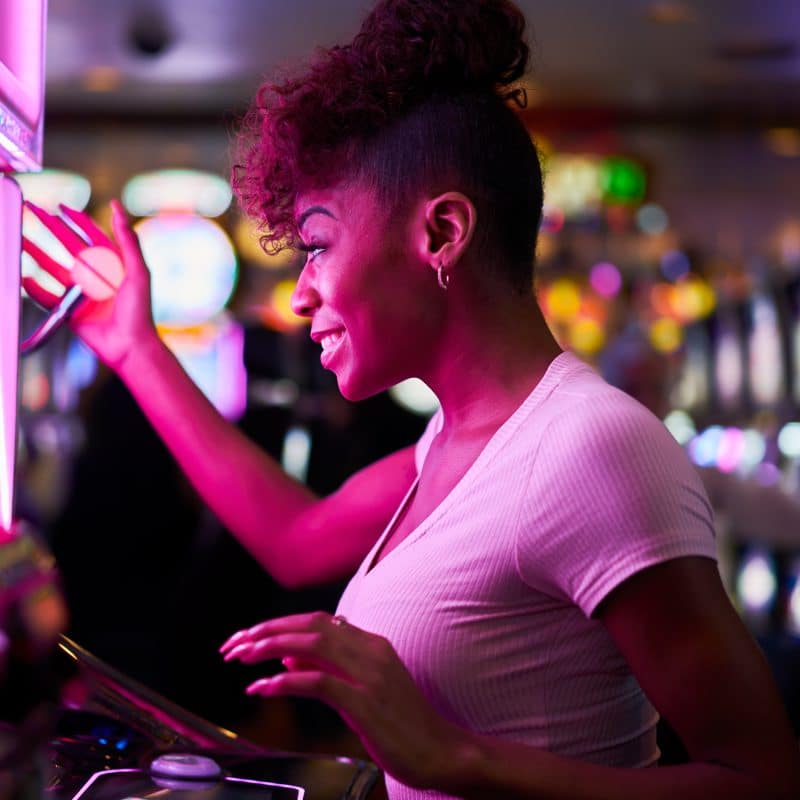 happy woman gambling at casino playing slot machin 2025 04 01 01 29 53 utc