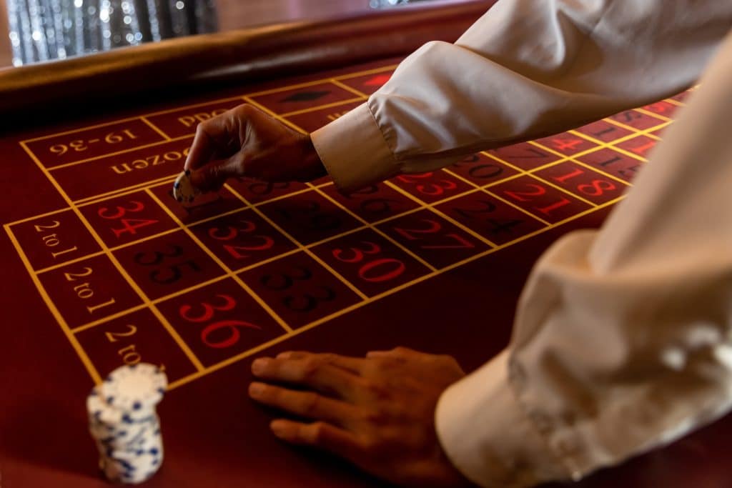 poker scene with gambler s hands game chips and d 2025 06 10 20 21 36 utc