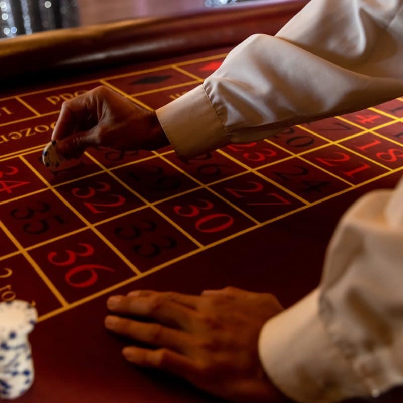 poker scene with gambler s hands game chips and d 2025 06 10 20 21 36 utc